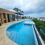 Stylish Condo With Roof Top Ocean Views Near Mamitas Beach And 5Th Ave